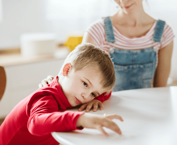 Boy Playing With Toys In Classroom