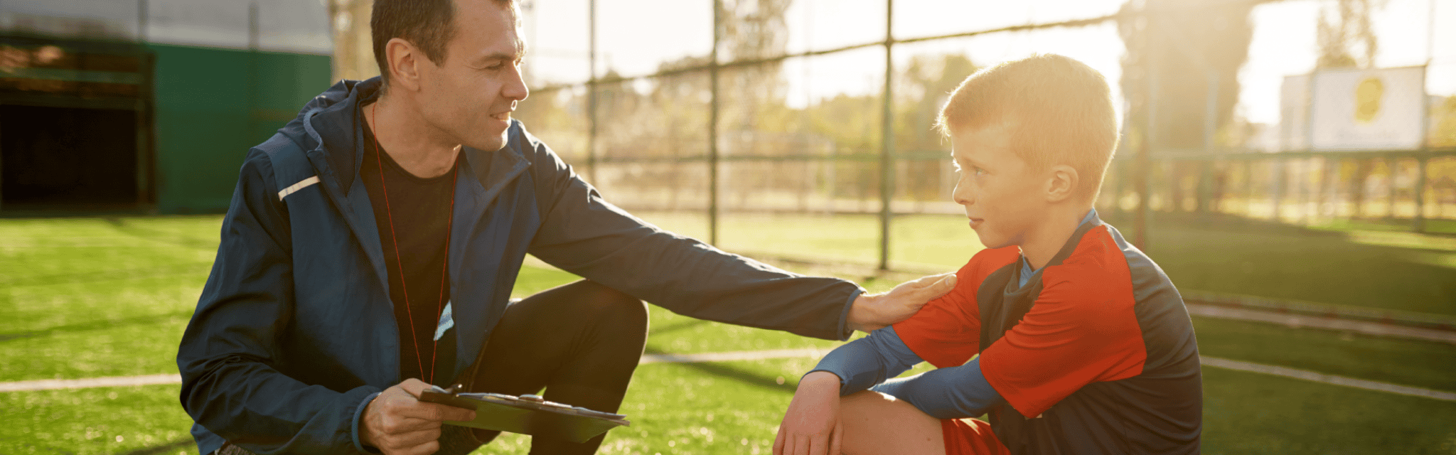 Coach Comforting Young Athlete