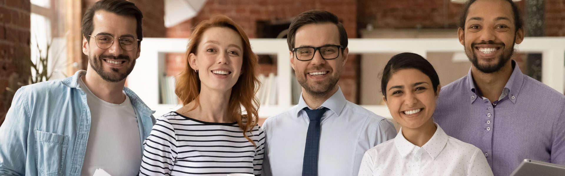 Diverse Team Smiling In Office