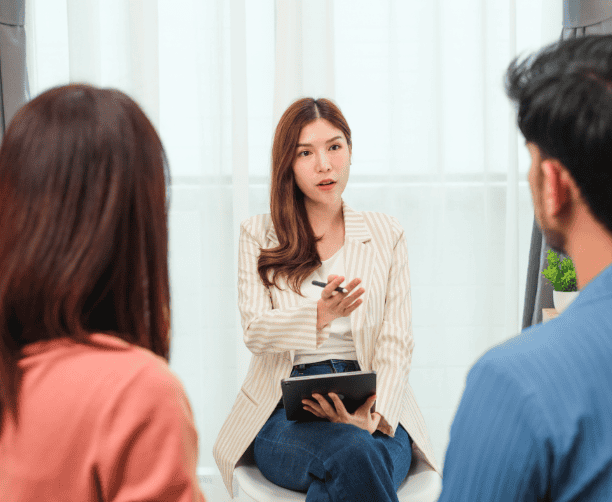 Family Greeting Woman In Friendly Meeting