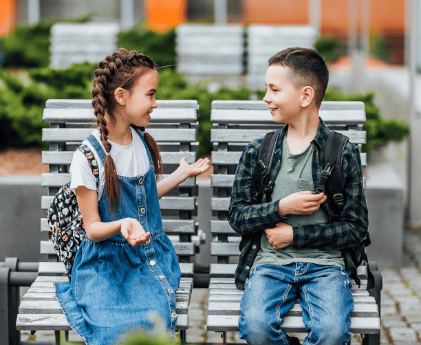 Kids Talking On School Bench