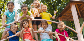 Male Teacher Engaging Young Students In Group Activity