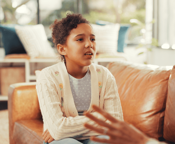 Mother Dropping Off Child At Preschool