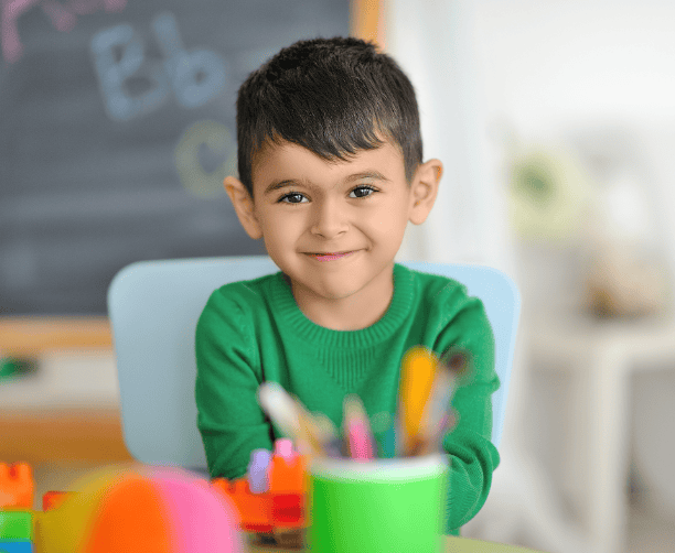 Sad Boy Sitting At Table With Mother