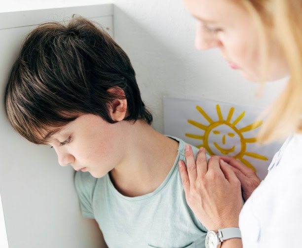 Smiling Student Writing In Class