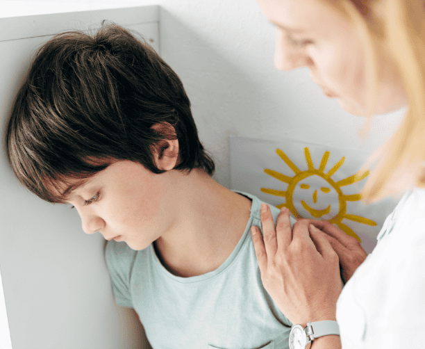 Smiling Student Writing In Class