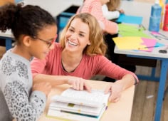 Speech Therapist Working With Young Girl