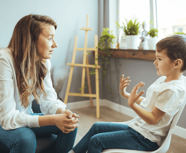 Teacher Helping Student With Homework