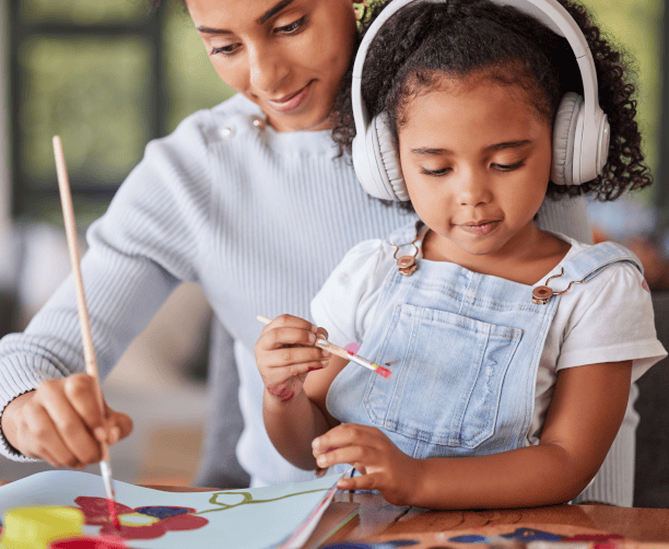 Therapist Guiding Child In Drawing Activity
