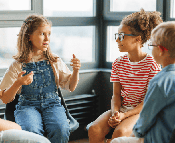 Tutor Teaching Young Boy In Library