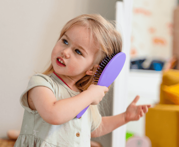 Young Child Learning To Brush Teeth Independently
