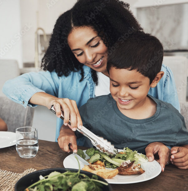 Mom, children and eating food in home together for lunch, dinner table and healthy meal. Happy family, mother and kids smile for dining in house with love, care and happiness of delicious supper