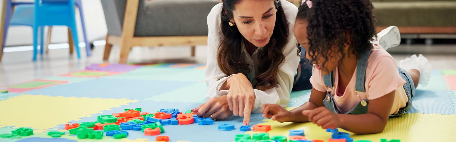 Early Childhood Educator Girl Learning Colorful Alphabet Letters